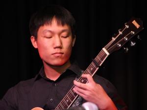 Student playing guitar