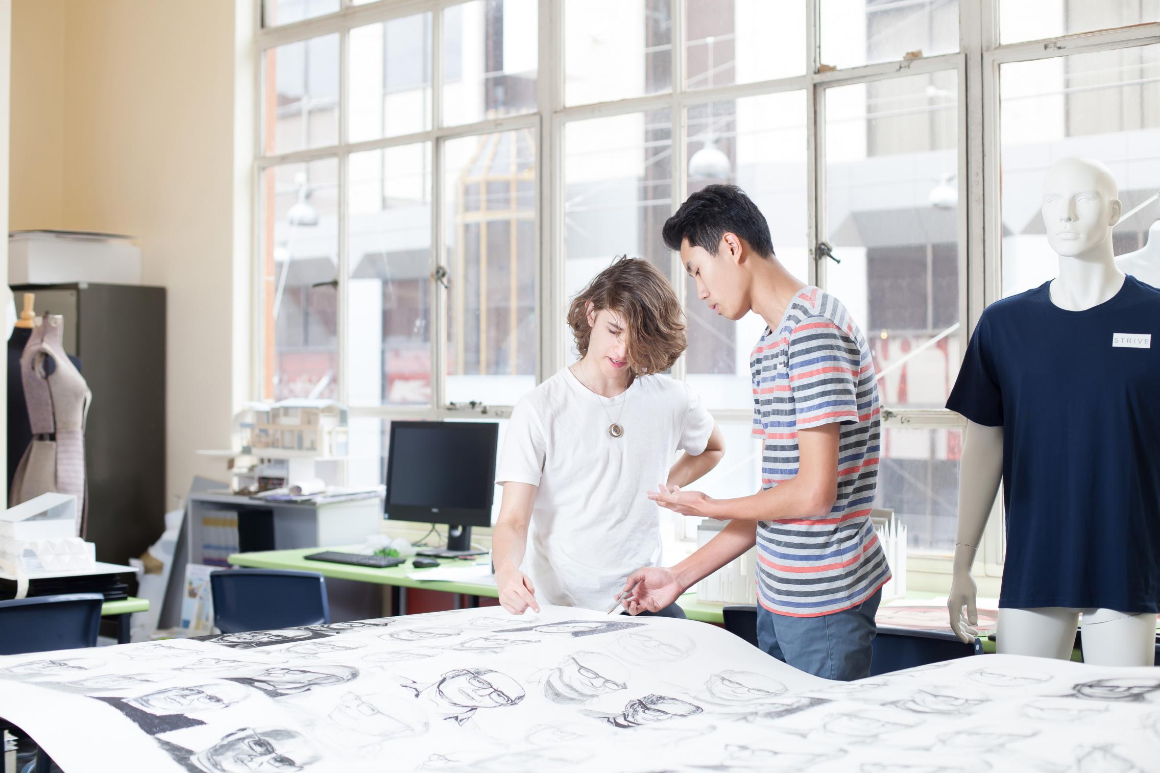 Students looking at work