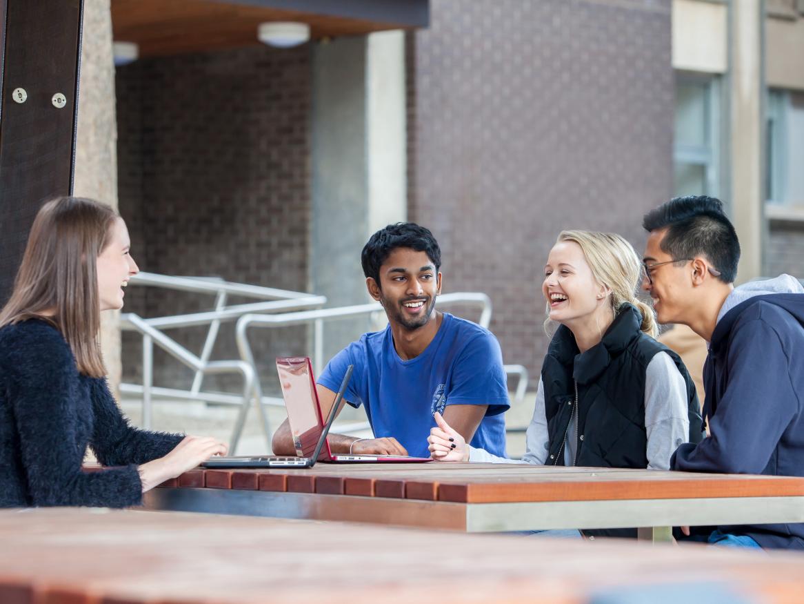 students talking outside